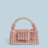Sac à main en perles de cire rose texturé de niche avancée fait à la main